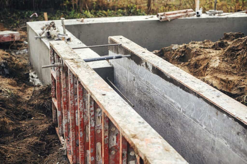 Concrete pool formwork under construction for a custom backyard pool.